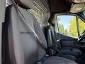 2023 Mercedes-Benz Sprinter 2500 interior featuring two front seats with seatbelts and a steering wheel visible in the foreground
