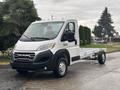 A 2023 RAM Promaster 3500 chassis cab in white with a boxy design and distinct RAM branding on the front grille