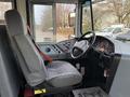 Interior of a 2013 International 4300 showing the driver's seat dashboard and various controls