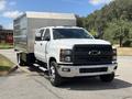 2020 Chevrolet Silverado in white with a large silver cargo box attached on the back positioned prominently in the image