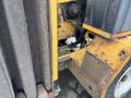 A 2015 Vermeer Corporation BC1200XL wood chipper showing detailed components including the engine area and metal casing with some rust and wear