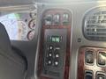 Dashboard control panel of a 2022 Freightliner M2 106 featuring buttons for gear selection and an illuminated display showing the gear position