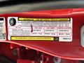 A label detailing tire information and loading specifications for a 2013 RAM 2500 with information on original tire size and other safety instructions