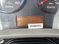 Dashboard display of a 2013 International WorkStar showing RPM speedometer temperature gauge and an odometer reading 81561 kilometers