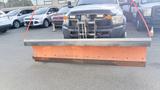 A 2016 RAM 5500 truck equipped with a large orange snow plow attached to the front