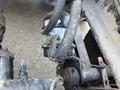 Close-up view of the brake system components in a 2022 Freightliner Cascadia showing various hoses and fittings attached to the framework
