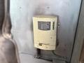 A Xantrax TrueCharge2 20A battery charger mounted on a wall