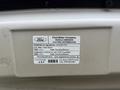 2013 Ford E-350 with a vehicle emission control information label displaying regulations fuel type and OBD details