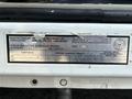Close-up of a label from a 2009 Ford F-450 Super Duty detailing vehicle specifications and manufacturer information