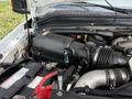 Under the hood of a 2008 Ford F-550 showcasing the engine components including the air intake system and battery connections