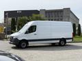 White 2023 Mercedes-Benz Sprinter van parked with a sliding door visible on the side and no visible branding or logos