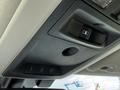 Overhead console of a 2018 RAM 1500 featuring buttons for garage door opener and a small storage compartment