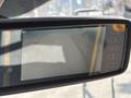 Interior view of a 2018 Ford Transit-350 rearview mirror displaying a blank screen