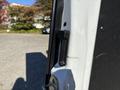 A black handle on the side door of a 2021 Mercedes-Benz Sprinter 2500 van
