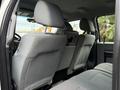 The interior of a 2016 Ford F-550 Super Duty showing the backseat area with gray fabric seats and headrests