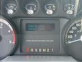 Dashboard display of a 2011 Ford F-350 SD showing engine idle status and total hours of 2284 with various gauges for speed and fuel levels