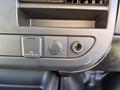 A close-up of a 2019 GMC Savana dashboard, featuring power outlet options including an AC 120V outlet and a USB port