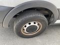 A close-up of a tire on a 2019 Ford Transit showing the tread pattern and rim design