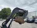 A 2017 John Deere 50G excavator arm with a large bucket facing downward