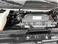 A close-up view of the engine compartment of a 2022 GMC Savana showing various components including the air filter housing and engine cover