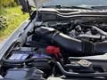 A close-up view of the engine compartment of a 2019 Ford F-550 showcasing the air intake and battery components