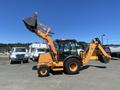 A 2016 Case 580 Super N backhoe loader in orange with a front bucket attachment and a rear digging arm visible from the side