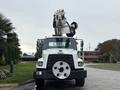 A white 2013 Freightliner 114SD truck with a unique elevated boom attachment on top facing forward