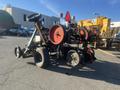 A 2017 R&R Reel featuring multiple large spools and a sturdy frame with wheels for mobility