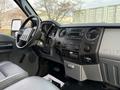 Interior view of a 2015 Ford F-350 showing the dashboard stereo controls steering wheel and gear shift