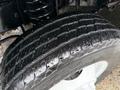 Close-up of a 2017 Ford E450 tire showing tread pattern and surface details