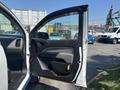 A 2017 Chevrolet Colorado with an open driver-side door showcasing the interior details and door panel design