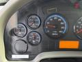 Dashboard of a 2011 International 4300 displaying gauges for speed RPM water temperature oil temperature and transmission temperature