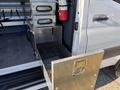 A stainless steel storage drawer extended from the side of a 2024 Mercedes-Benz Sprinter 2500 with multiple metal drawers above it