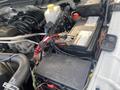 Engine compartment of a 2016 RAM 5500 displaying various components including the battery coolant reservoir and electrical connections