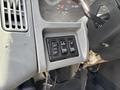 Controls and buttons for lights on the dashboard of a 2006 International 4300 vehicle