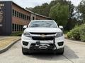 A front view of a 2017 Chevrolet Colorado with a towing hitch attached to the front bumper