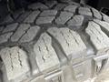 A close-up view of the tread pattern of a tire from a 2019 Ford F-150 showcasing rugged grooves and traction elements