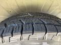 A close-up of the tread on a tire from a 2020 RAM ProMaster 3500 showing deep grooves and rugged design for traction and durability