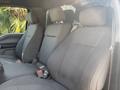 Interior view of a 2019 Ford F-150 featuring two front bucket seats in gray fabric with seatbelts visible