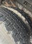 Close-up of a tread pattern on a heavily worn tire from a 2006 E-One Typhoon showing deep grooves and uneven wear
