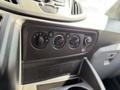 Control panel of a 2018 Ford Transit featuring knobs for temperature and fan speed along with an air conditioning button and a USB port