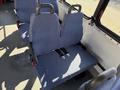 A blue fabric seat with a split backrest designed for a 2017 Chevrolet Express van featuring adjustable armrests and seatbelts