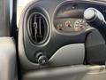 Close-up of the dashboard controls in a 2002 Ford Econoline featuring air vent and knob for controlling dashboard lighting