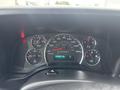Dashboard of a 2022 GMC Savana showing speedometer fuel gauge and various warning lights with a digital odometer reading 104498 km