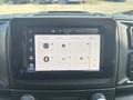 Close-up of the touchscreen display inside a 2022 RAM Promaster 350 showing various audio and navigation options