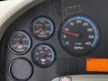 Dashboard of a 2012 International 4300 showing gauges for RPM, water temperature, transmission temperature, oil pressure, and an alert display
