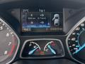 Dashboard display of a 2014 Ford Escape showing trip information including distance traveled fuel efficiency and remaining fuel levels
