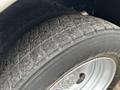 Close-up of a tire from a 2018 Ford F-550 showcasing the tread pattern and wheel rim