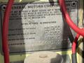 A metal plate displaying specifications and identification details for a 1976 GMC Palm Beach vehicle with ratings in pounds as manufactured