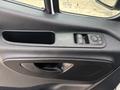 Close-up of the door panel of a 2020 Mercedes-Benz Sprinter 2500 featuring window controls and a handle